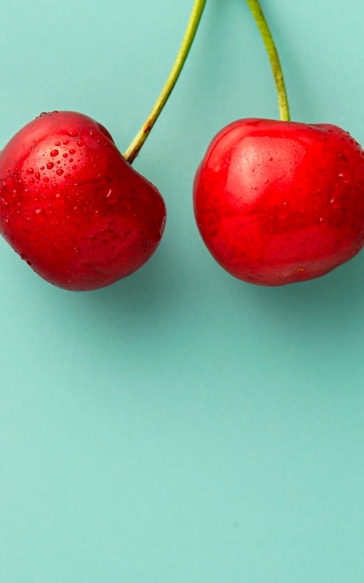 A cherry on a blue background